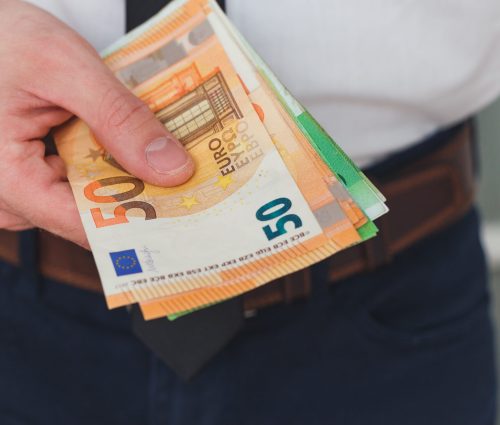 Detail of man hands with money, euro notes